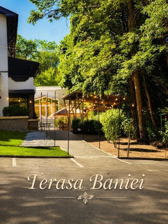 a sign that says temasena balmer in front of a building at Terasa Baniei in Bucovăţ