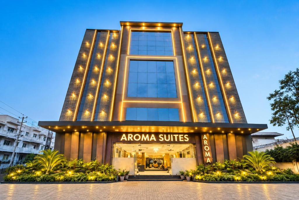 a building with lights in front of it at Hotel Aroma Suites Delhi - With Free Airport Drop in New Delhi