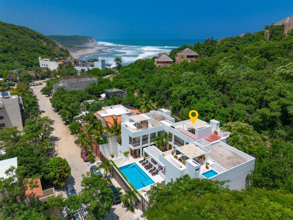 an aerial view of a house and the ocean at 3060 - Bocana Beach Condo B2 in Valerio Martínez