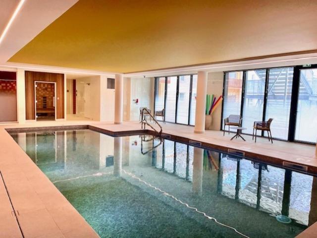 a large swimming pool in a house with at DOMITYS - Les Ambres in Cognac