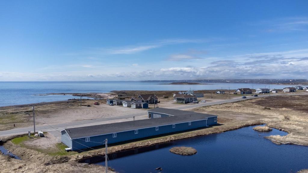 an aerial view of a building next to a body of water at Hotel Blanc-Sablon in Blanc-Sablon