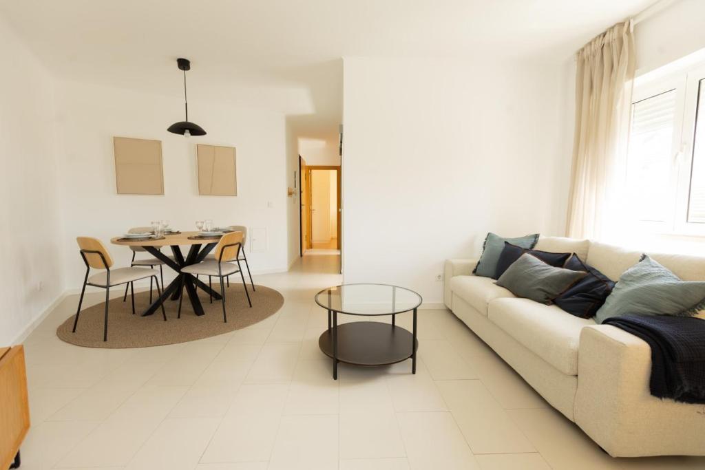 a living room with a couch and a table at BV 01 Apartment in Amadora