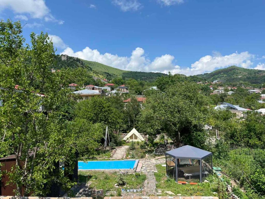 an aerial view of a garden with a swimming pool at Matevosyans Guest House in Goris