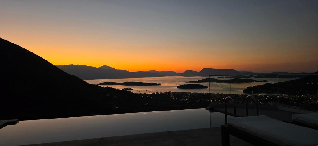 a view of a sunset from a house at Boutique Hotel Desun Suites in Kolónion
