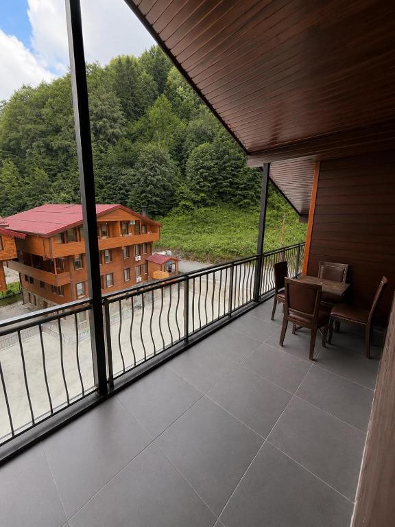 a balcony with a view of a building at Ena Suites in Çaykara