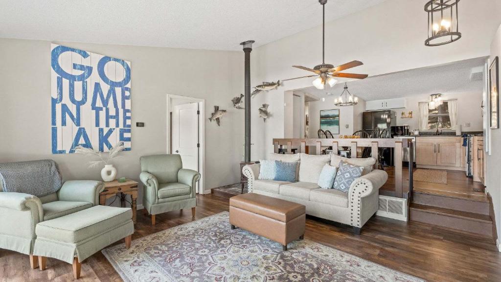 a living room with a couch and two chairs at Honey Hole 3 Well Dock in Camdenton