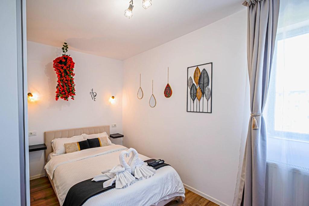 a bedroom with two beds and a window at ChicStudio Full Kitchen AC Free Parking Popcorn in Chiajna