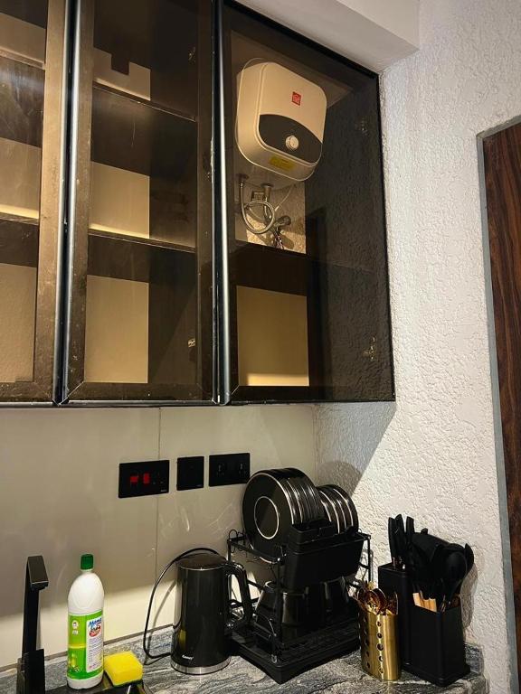 a kitchen counter with a toaster on a stove at Fa Apartment in Lekki