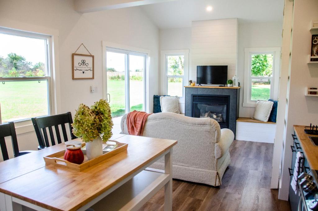 a living room with a couch and a fireplace at Blue Moon Bungalow in Tillsonburg