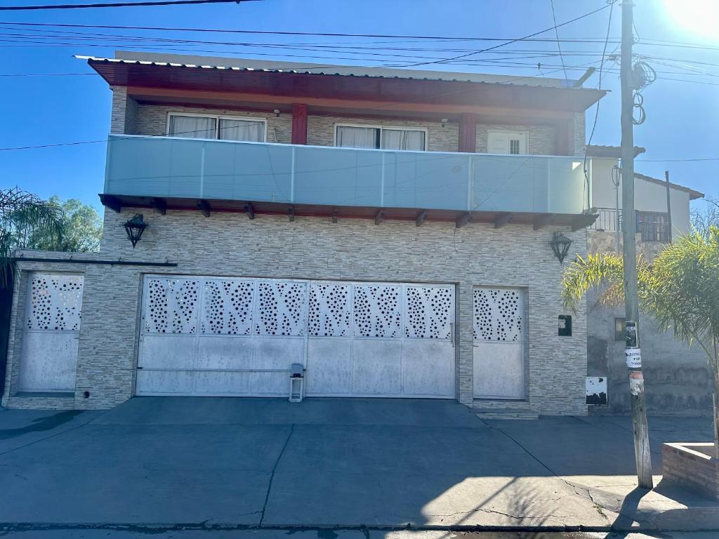 a brick house with a fence in front of it at Jean Pierre in La Merced