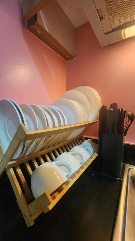 a bunch of plates sitting on shelves in a room at 1556 Shore Residences tower C - MOA in Sampong