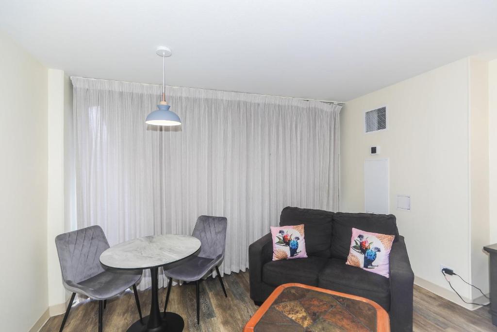 a living room with a couch and a table at Ilikai Marina 1381 in Honolulu