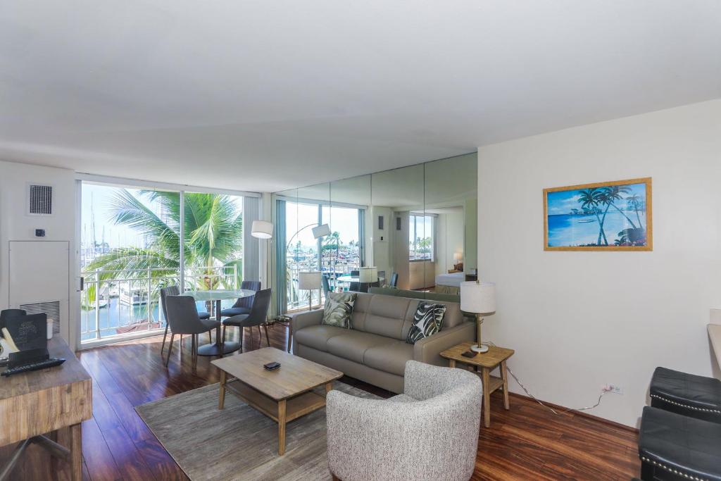 a living room with a couch and a table at Ilikai Marina 382 in Honolulu