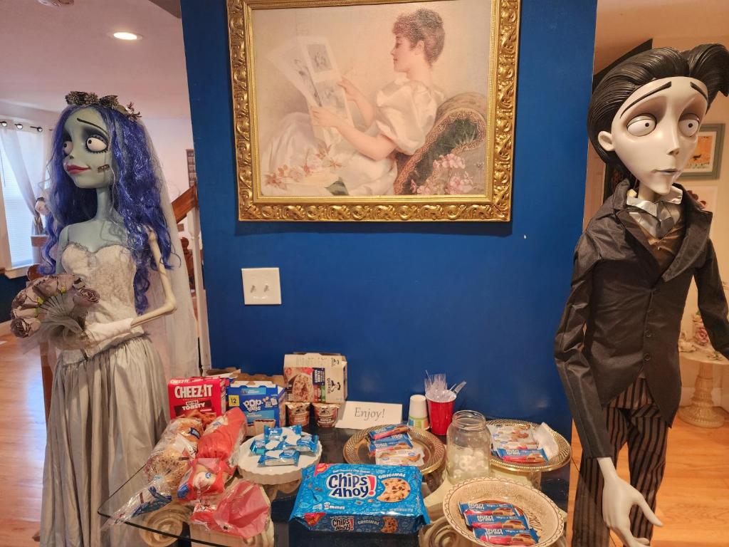 two costumes standing next to a table full of food at Old Salem House 15 mins from downtown Salem in Peabody