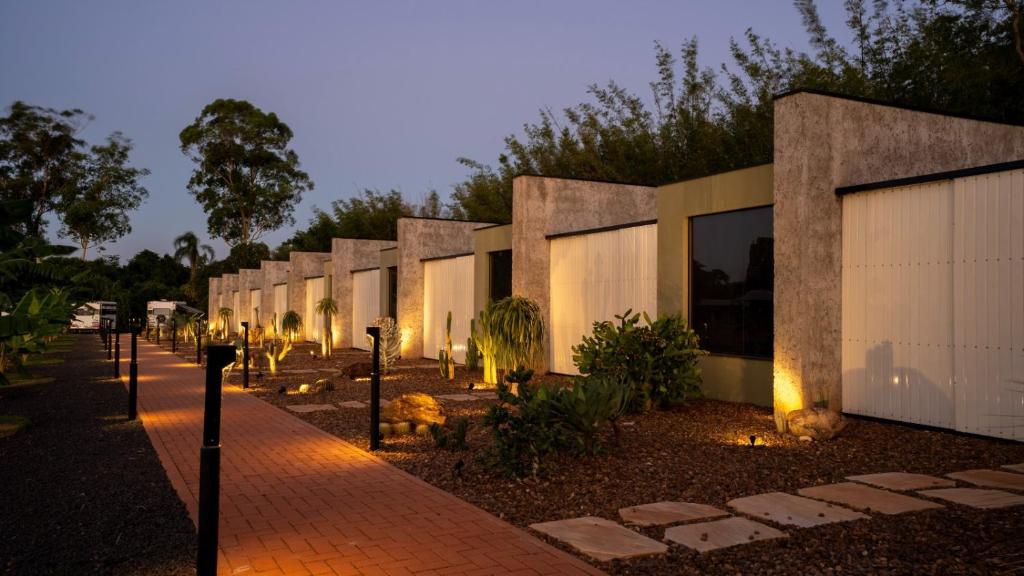 a row of buildings with lights in front of them at Vila Chalés in Itu