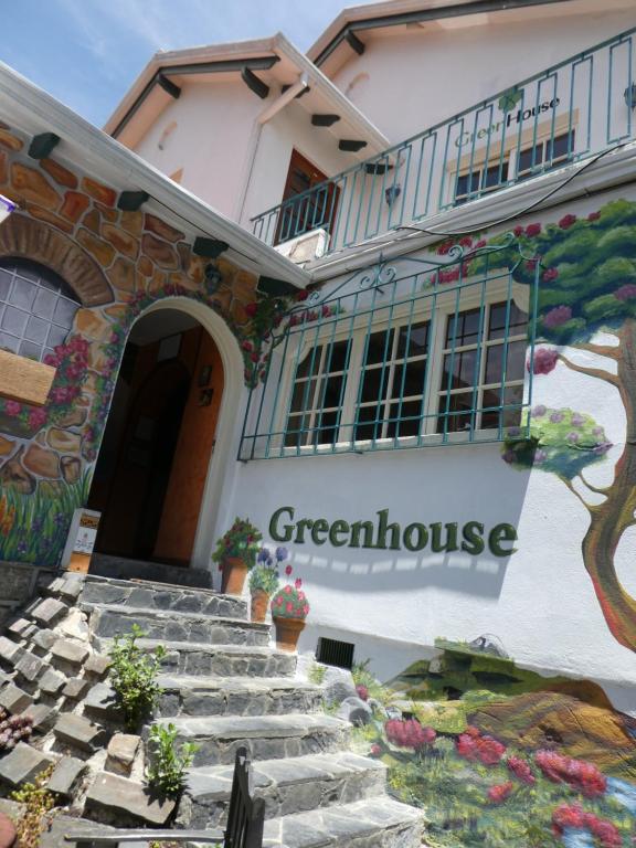 a building with a sign that reads green house at Greenhouse Bolivia in La Paz