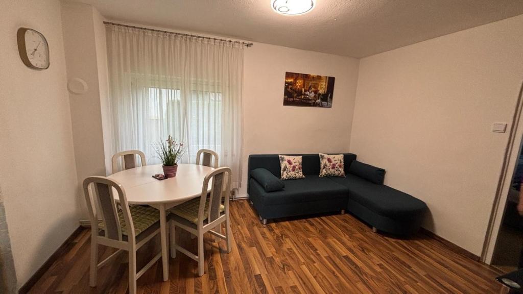a living room with a table and a couch at Alina in Graz