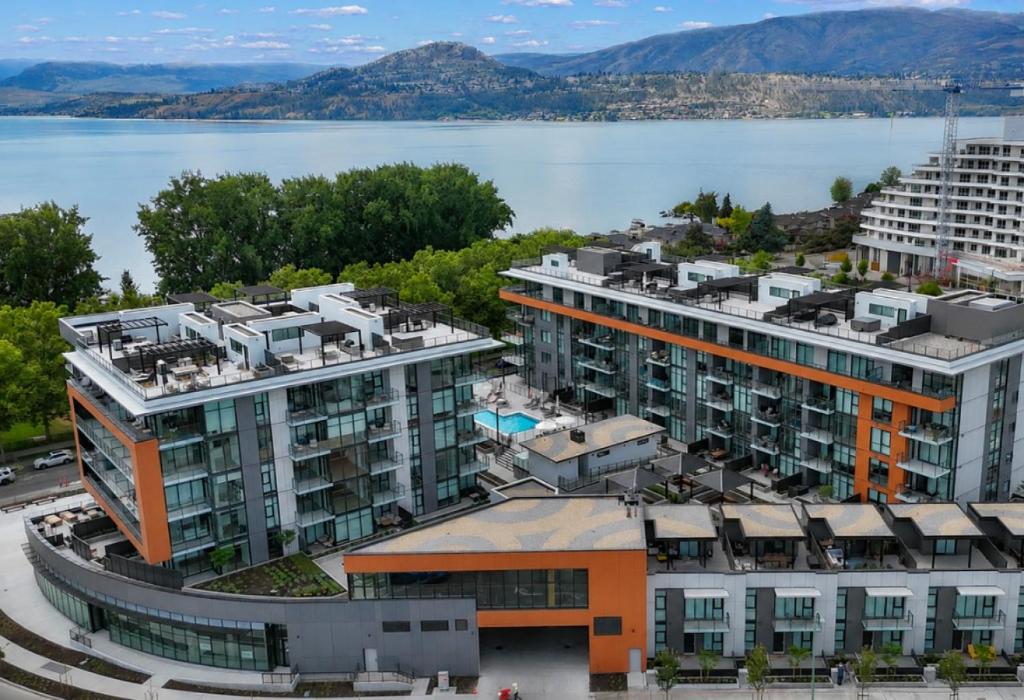 an aerial view of a building next to a body of water at Gyrobeach Getaway in Kelowna