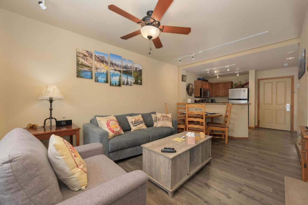 a living room with a couch and a table at Zephyr Mountain Lodge Unit 1306 in Winter Park