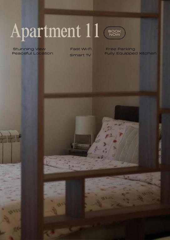 a poster of a bedroom with a bed and a bed sqor at Apartment 11 - Free Parking in Zlatibor