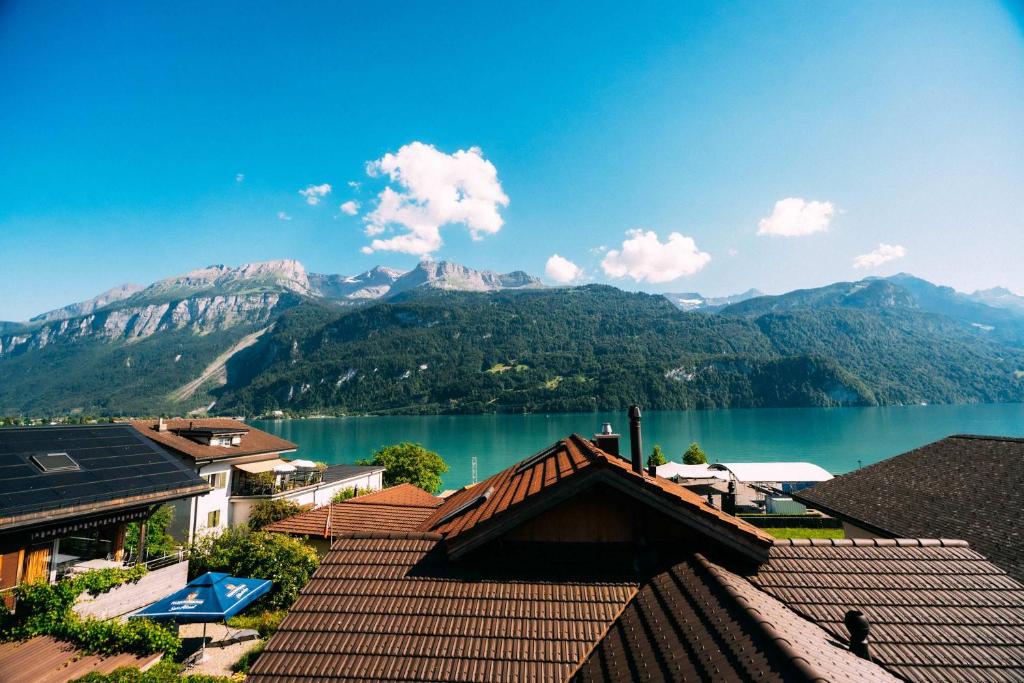 a view of a lake with mountains in the background at Cozy Apartment - Stunning Views in Brienz