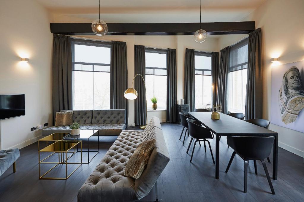 TV a/nebo společenská místnost v ubytování "DE BANK" - Hotel Apartments