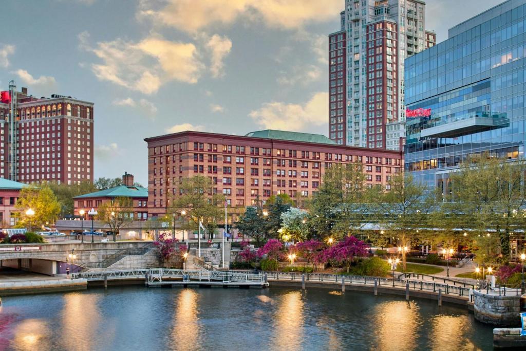 a bridge over a river in a city with tall buildings at Courtyard Providence Downtown in Providence