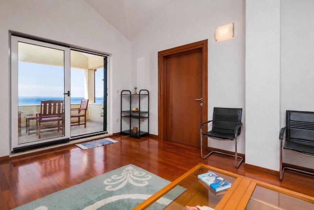 a living room with a view of the ocean at Luxury Residence Omis in Omiš