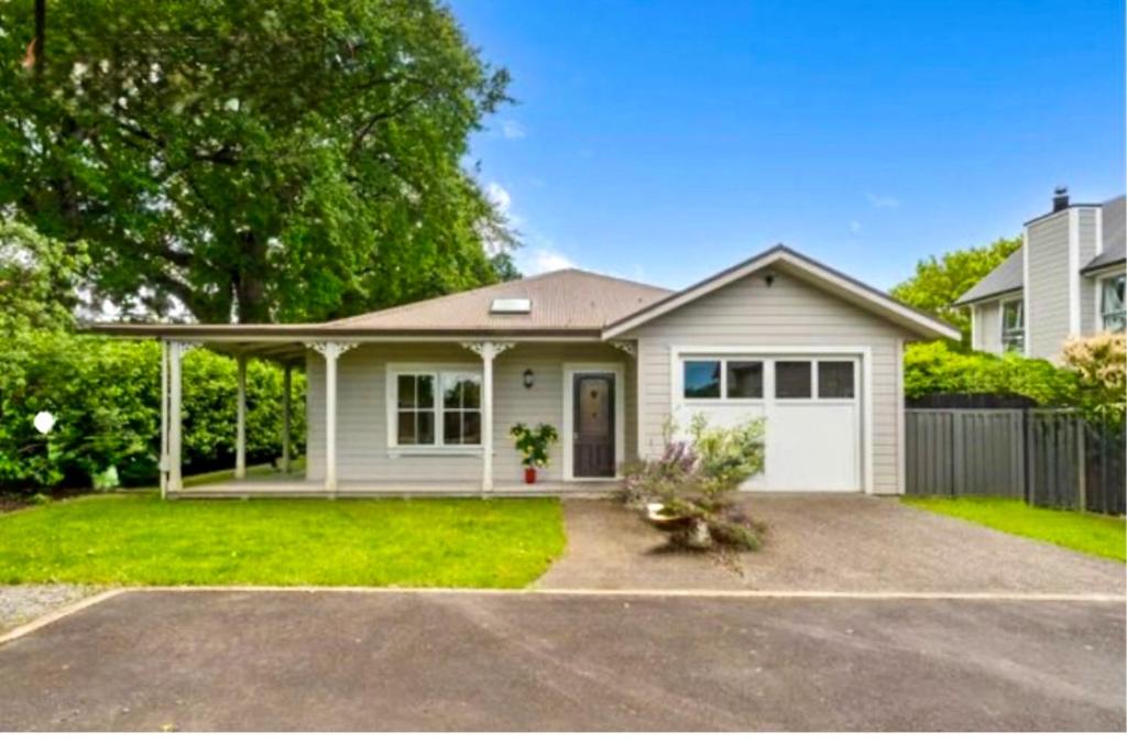 a house with a white garage at Wood Street Haven in Greytown