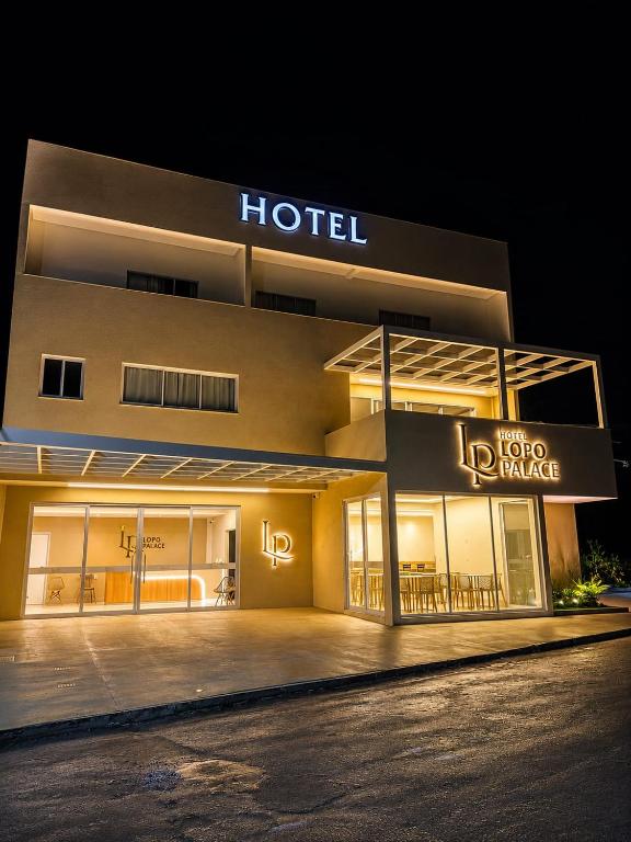 a hotel is lit up at night at Lopo Palace in Porangatu