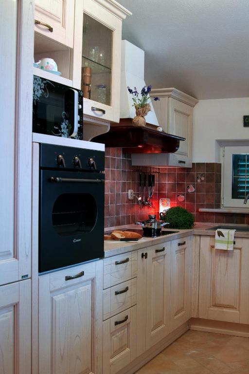 Kuchyň nebo kuchyňský kout v ubytování Apartment Splendid