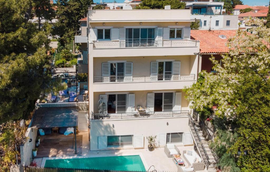 an aerial view of a house with a swimming pool at Stunning Home In Split in Split