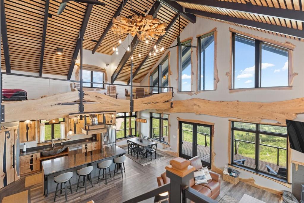 an aerial view of a living room and kitchen with large windows at The Bald Doe in Sturgis