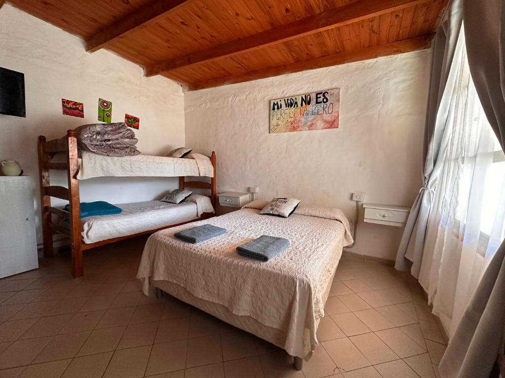 a bedroom with two bunk beds and a window at Functional Department in Colorado River