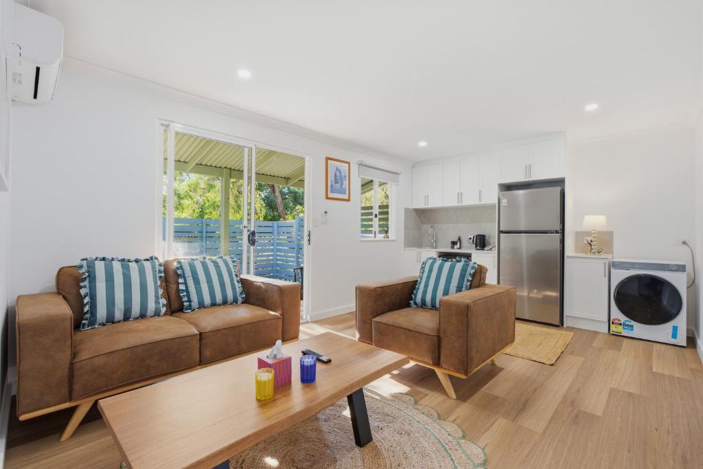 a living room with two couches and a table at Ralph Escapes Yallingup in Yallingup
