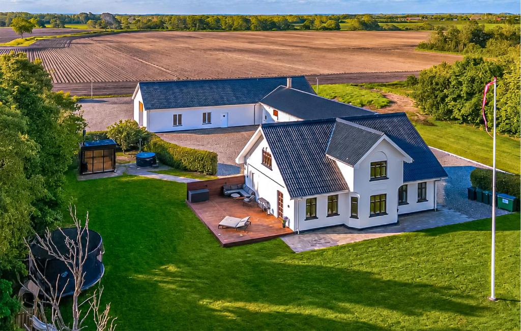 an aerial view of a white farm house at Nice Home In Hadsund With Sauna in Hadsund