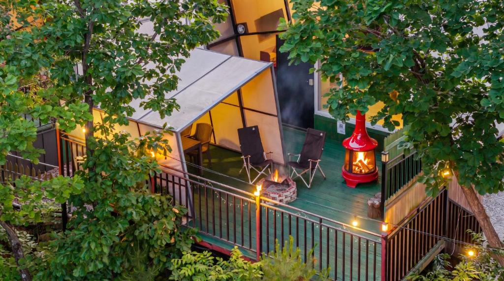 an aerial view of a balcony of a building with a lantern at Hongcheon Opera Bien Glamping in Hongcheon