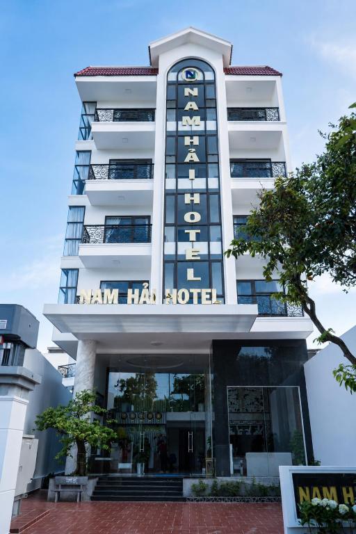 a building with the name of the hotel at Nam Hai Con Dao Hotel in Con Dao