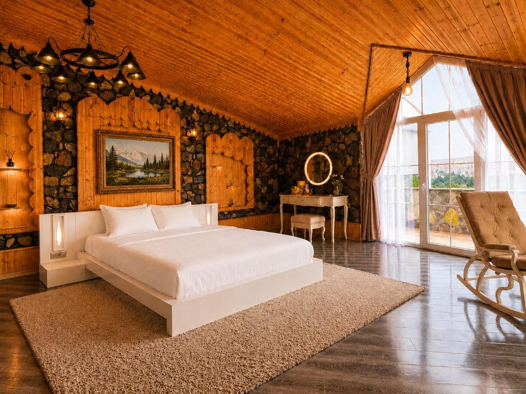 a bedroom with a white bed and a table at Ganja Comfort Home in Ganja