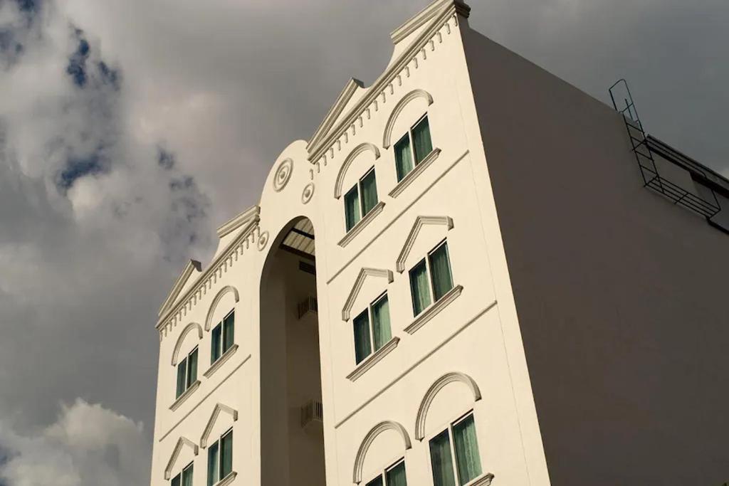 a tall white building with windows on top of it at 1001 Nights Boutique Inn in Cagayan de Oro
