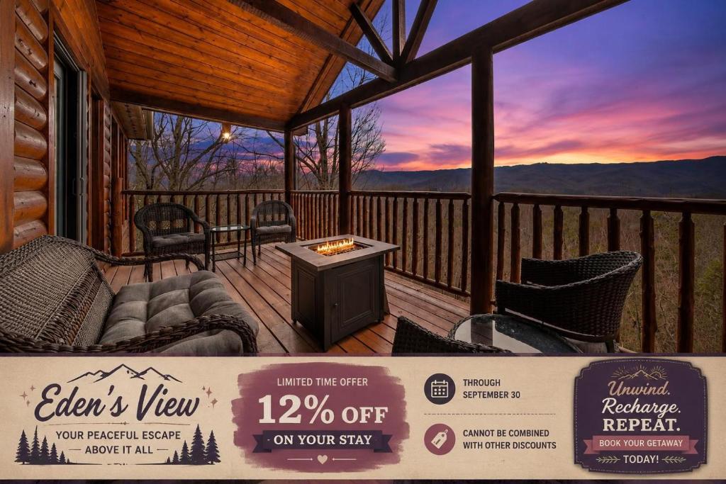 a screened in porch with a table and chairs on a deck at Eden's View in Gatlinburg