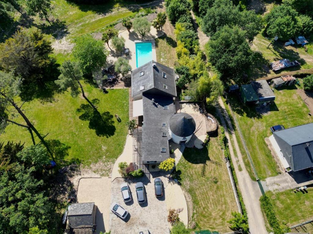 an overhead view of a building with a pool at La grande maison in Orgères