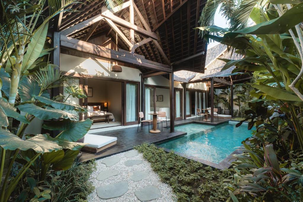 an indoor pool in the middle of a villa at ALMA SHANTI Boutique Hotel in Uluwatu