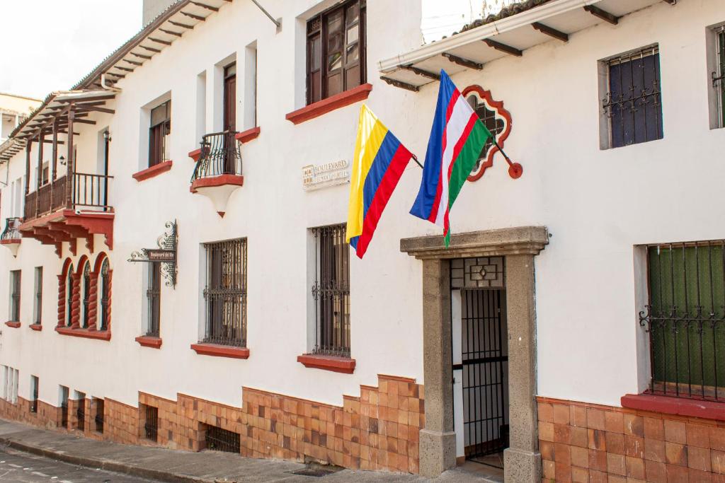 a flag on the side of a building at Hotel Boulevard del Río in Cali