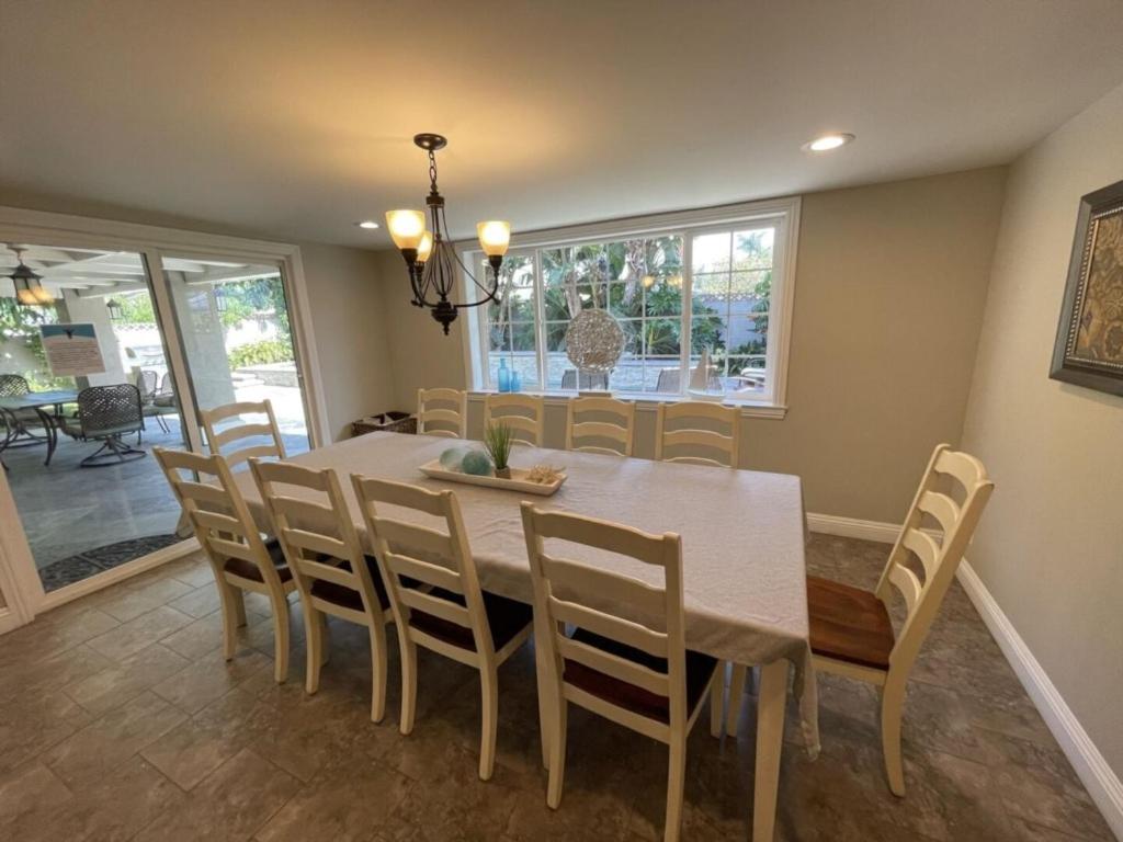 a dining room with a table and chairs at Wonderful 4 Bedroom 3 Bath Pool Home 3/4 Mile To Disney in Anaheim