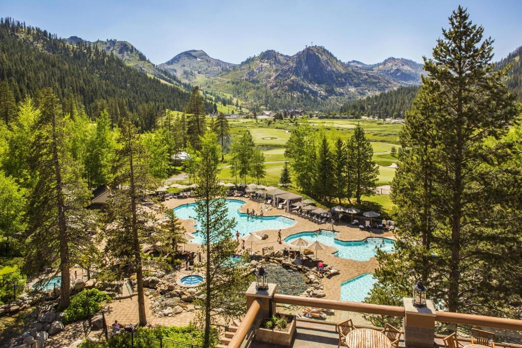 an aerial view of a resort with two pools at Everline Resort and Spa, Lake Tahoe in Olympic Valley