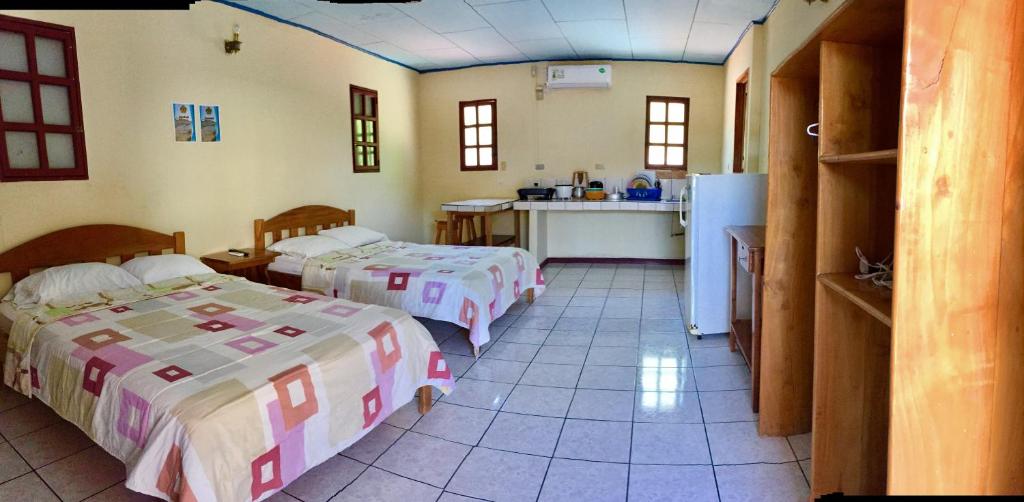Postel nebo postele na pokoji v ubytování Hotel Moctezuma