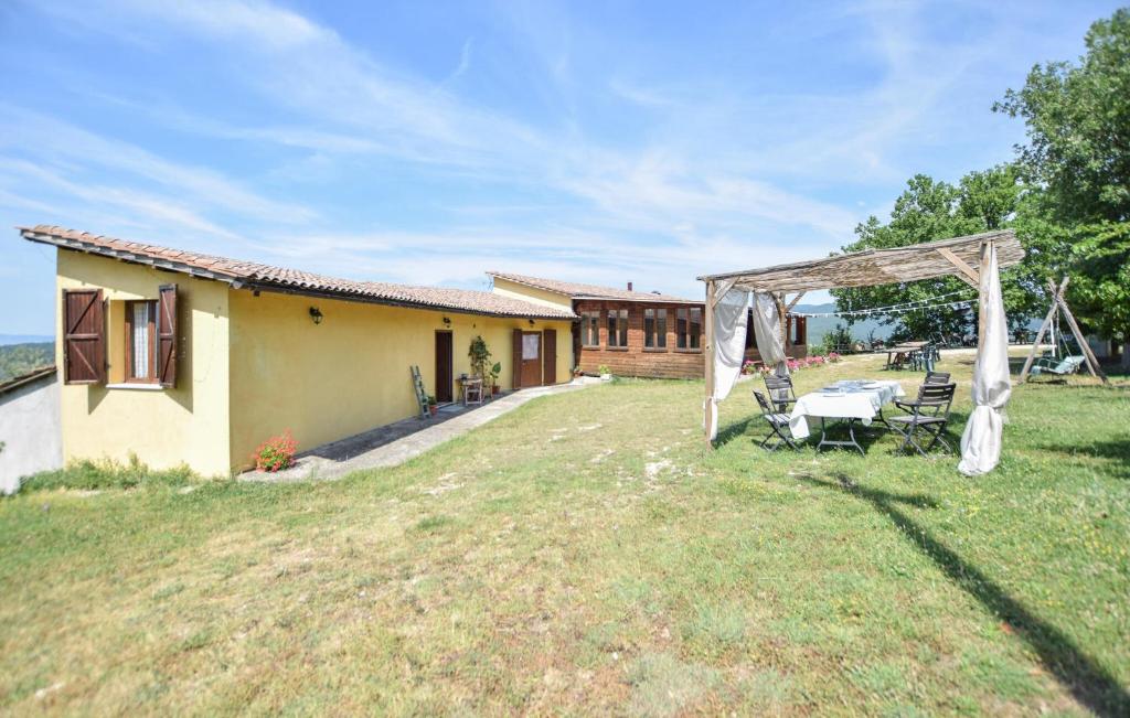a backyard with a table and a gazebo at Umbria Montefranco in Montefranco