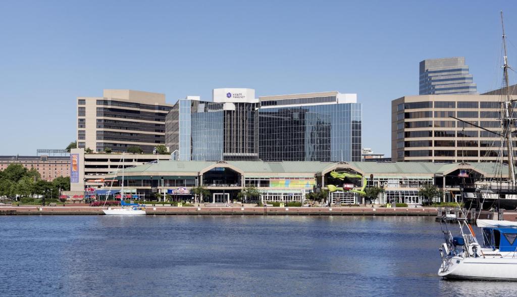 a boat in a body of water with buildings at Hyatt Regency Baltimore in Baltimore