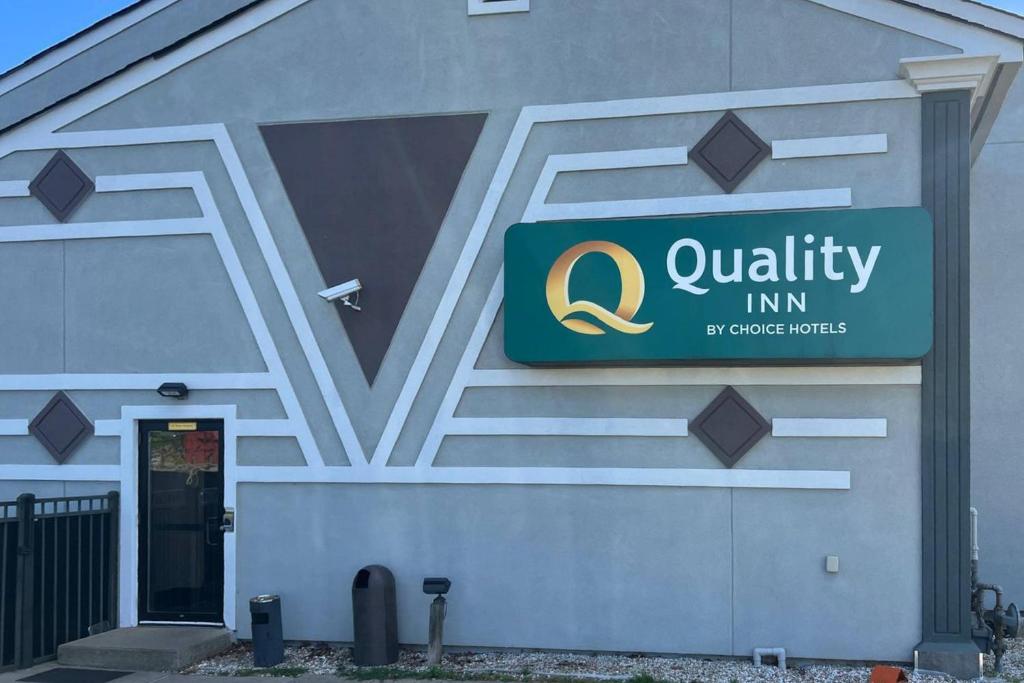 a building with a sign on the side of it at Quality Inn Plainfield I-395 in Plainfield
